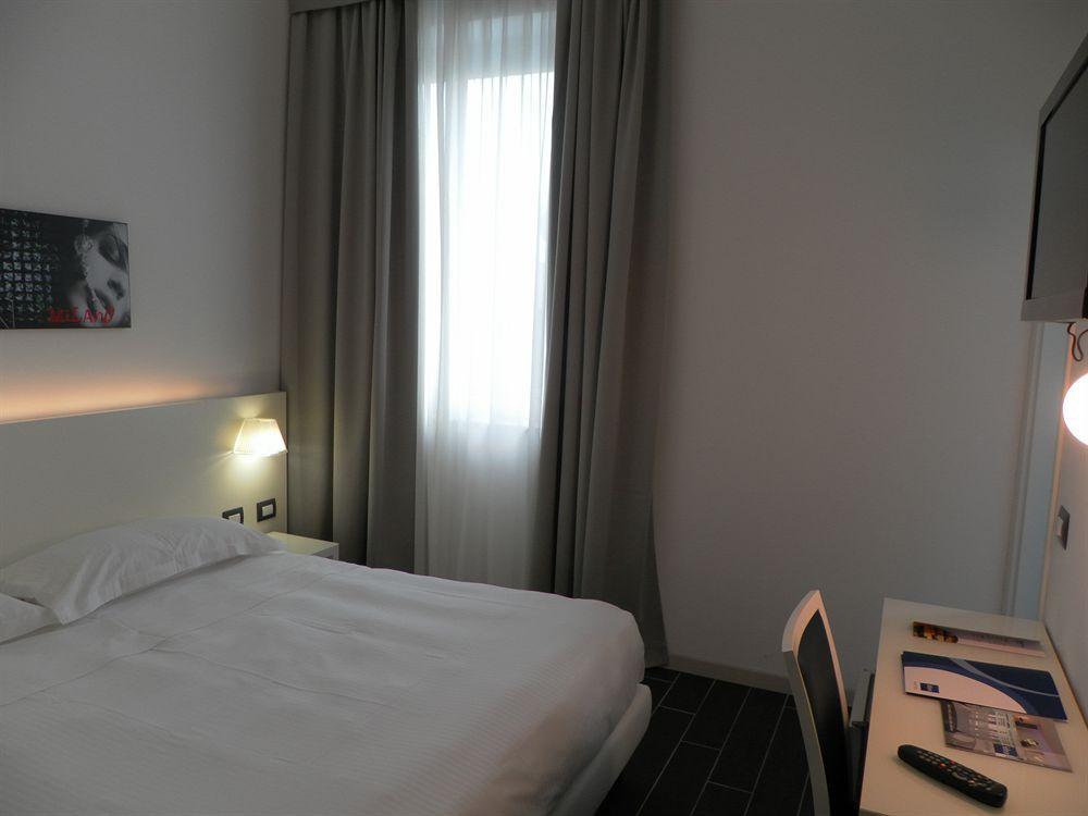 Smart Hotel Central Milão Quarto foto